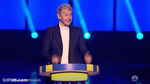 Ellen Degeneres Is Standing At A Podium On A Game Of Games Show GIF