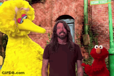 Elmo And Big Bird Are Standing Next To A Man In Front Of Sesame Street GIF