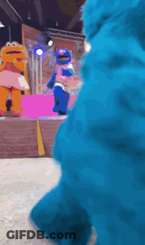 Elmo And Cookie Monster Dancing On Stage GIF