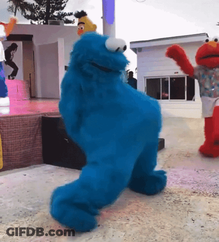 Elmo And Cookie Monster Dancing Together On Stage GIF