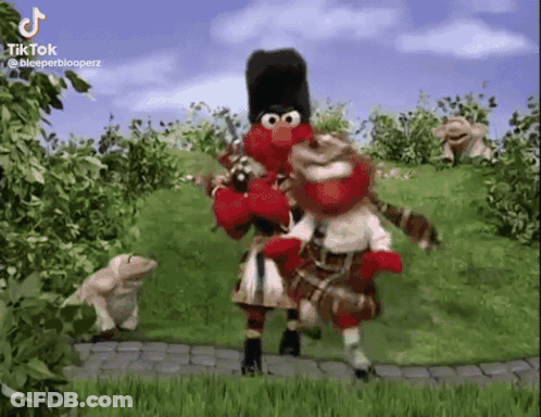 Elmo And Elmer Fudd From Sesame Street Are Playing Bagpipes In A Video . GIF