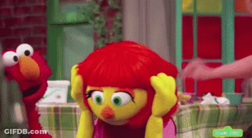 Elmo And Elmo Sitting At Table GIF