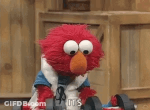 Elmo From Sesame Street Is Holding A Pair Of Dumbbells In His Hands . GIF