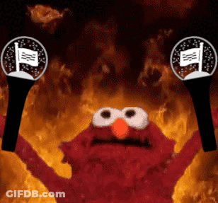Elmo From Sesame Street Is Holding A Pair Of Microphone In Front Of Flames GIF