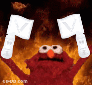Elmo From Sesame Street Is Holding Up Two Signs That Say ' Vanner ' GIF