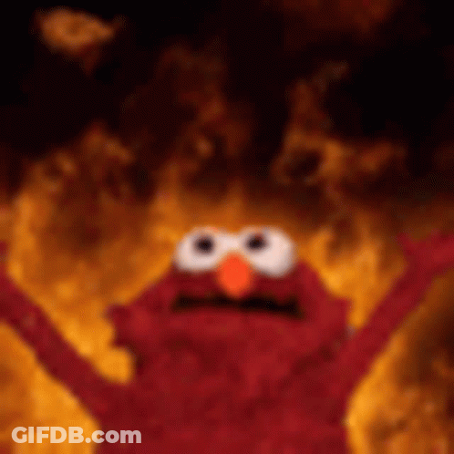 Elmo From Sesame Street Is On Fire With His Arms In The Air . GIF