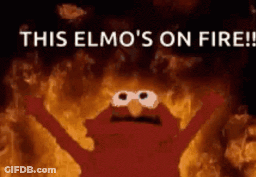 Elmo From Sesame Street Is On Fire With His Arms Outstretched GIF