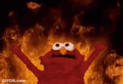 Elmo From Sesame Street Is On Fire With His Arms Outstretched GIF