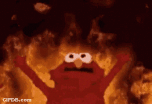 Elmo From Sesame Street Is On Fire With His Arms Outstretched And His Eyes Closed . GIF