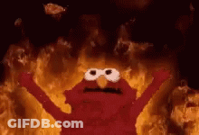 Elmo From Sesame Street Is On Fire With His Arms Outstretched And His Eyes Closed . GIF