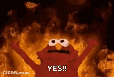 Elmo From Sesame Street Is On Fire With His Arms Outstretched And Says Yes . GIF