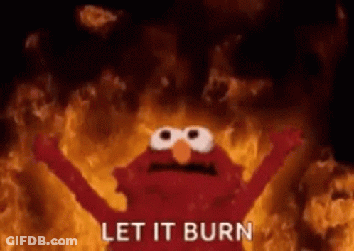 Elmo From Sesame Street Is On Fire With His Arms Outstretched And The Words `` Let It Burn '' . GIF