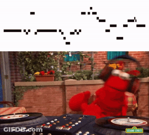 Elmo From Sesame Street Is Playing A Game Of Roulette On A Table GIF