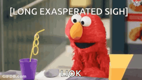 Elmo From Sesame Street Is Sitting At A Table With A Purple Cup Of Soda And A Straw . GIF
