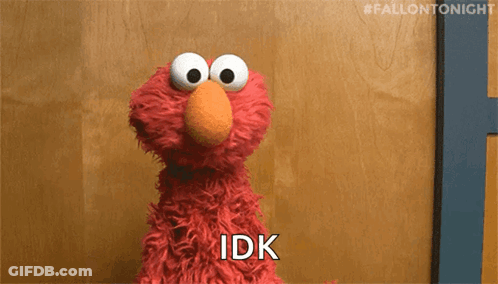 Elmo From Sesame Street Is Sitting In Front Of A Wooden Wall And Says Idk . GIF