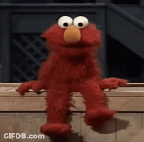 Elmo From Sesame Street Is Sitting On A Wooden Bench . GIF
