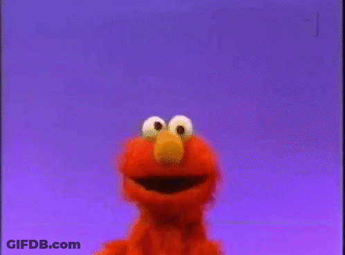 Elmo From Sesame Street Is Smiling And Looking At The Camera Against A Purple Background . GIF