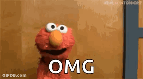 Elmo From Sesame Street Is Standing In Front Of A Door And Says Omg . GIF