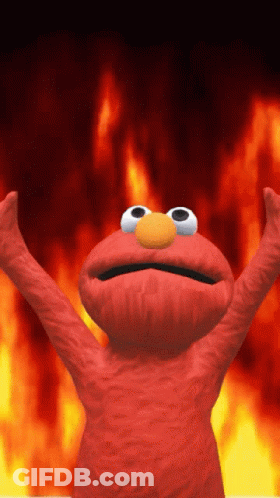 Elmo From Sesame Street Is Standing In Front Of A Fire Background GIF