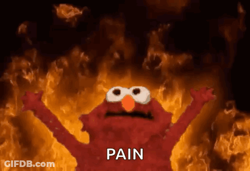 Elmo From Sesame Street Is Standing In Front Of A Fire With The Word Pain Written On It . GIF