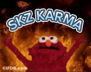 Elmo From Sesame Street Is Standing In Front Of A Fire With The Words " Skz Karma " Written Above Him GIF