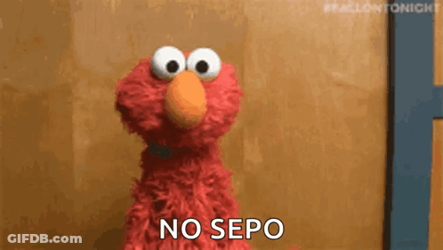 Elmo From Sesame Street Is Standing In Front Of A Wooden Wall And Saying `` No Sepo '' . GIF