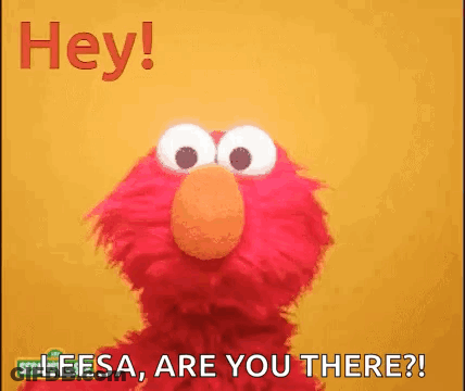 Elmo From Sesame Street Is Standing In Front Of A Yellow Background . GIF