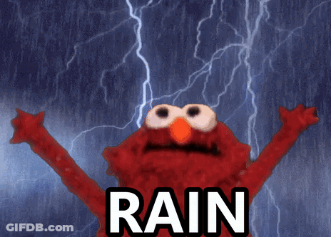 Elmo From Sesame Street Is Standing In The Rain GIF