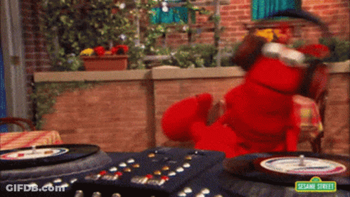 Elmo From Sesame Street Playing A Record On A Turntable GIF