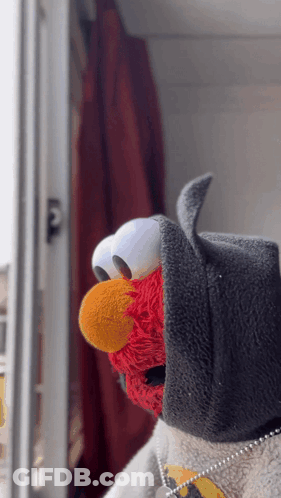 Elmo From Sesame Street Wearing A Batman Costume GIF
