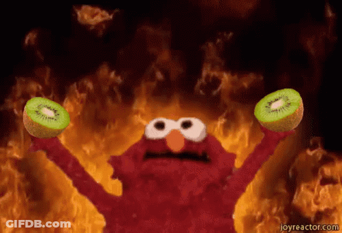Elmo Holding Two Kiwi Fruits By Fire GIF