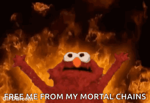 Elmo In Fire Saying Free Me From My Mortal Chains GIF