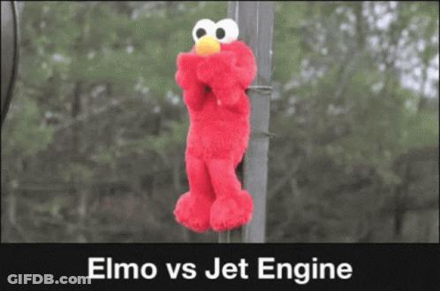 Elmo Is Hanging From A Pole With The Words Elmo Vs Jet Engine Below It GIF