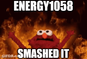 Elmo Is Standing In Front Of A Fire With The Words Energy 1058 Smashed It . GIF