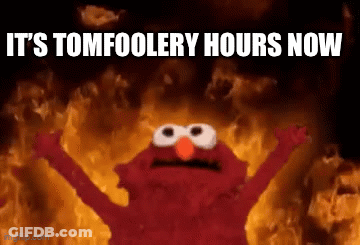 Elmo Is Standing In Front Of A Fire With The Words " It 'S Tomfoolery Hours Now " GIF
