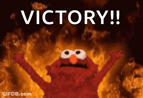 Elmo Is Surrounded By Flames And The Word Victory Is Written Above Him GIF