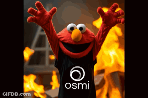 Elmo Is Wearing A Black Shirt With The Osmi Logo On It GIF