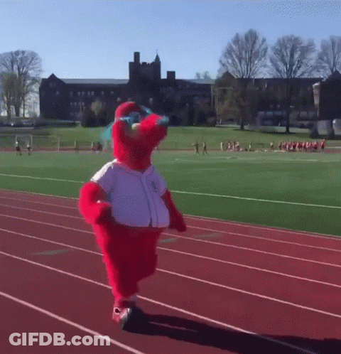 Elmo Mascot Running On A Track With A Bottle Of Water In His Hand GIF