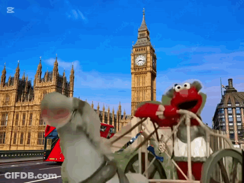 Elmo Riding Carriage In Front Of Big Ben London GIF