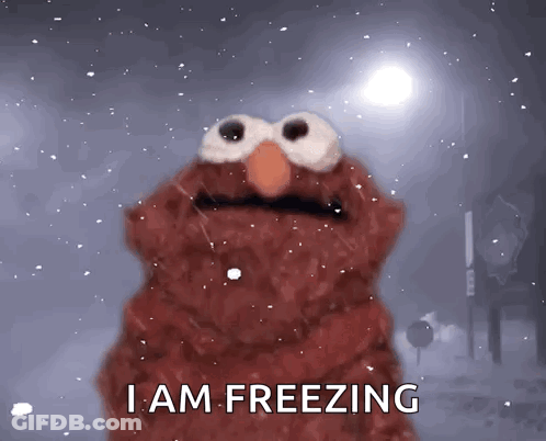 Elmo Says I Am Freezing While Standing In The Snow GIF