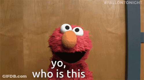 Elmo Says Yo Who Is This In Front Of A Wooden Door GIF
