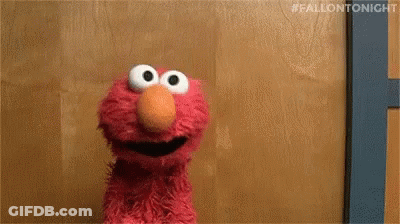 Elmo Sitting And Smiling GIF