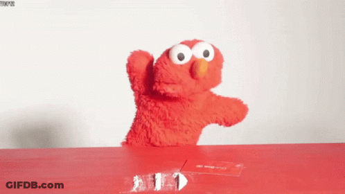 Elmo Sitting Next To Cocaine GIF