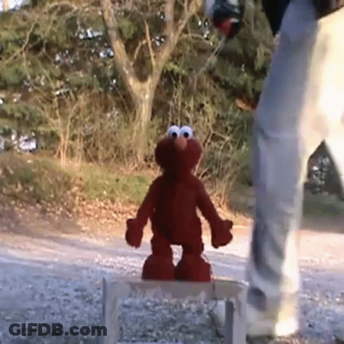 Elmo Standing On Wooden Stool GIF