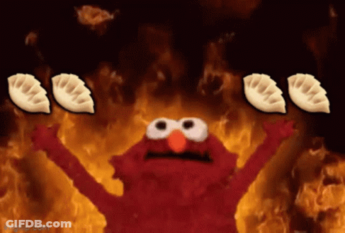 Elmo Surrounded By Flames Holding Dumplings GIF