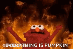 Elmo With Arms Outstretched Before Fire GIF