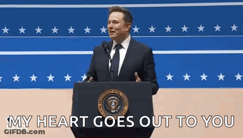 Elon Musk Is Giving A Speech At A Podium In Front Of A Microphone . GIF