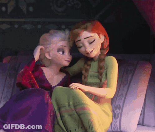 Elsa And Anna Are Sitting On A Couch And Hugging GIF