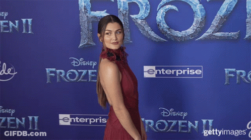 Elsa From Frozen Dancing In Front Of Purple Curtain GIF