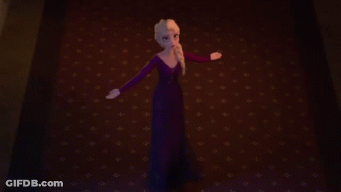 Elsa From Frozen Standing On Red Carpet With Arms Outstretched GIF